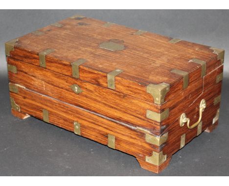 An Anglo-Indian padouk wood and brass bound writing box with brass side handles, on bracket style feet, 44 cm wide 