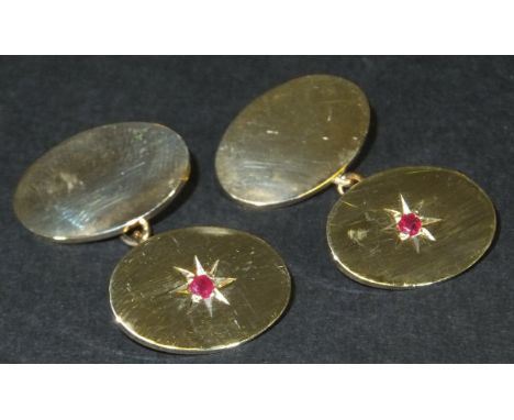 A pair of 9ct gold oval cufflinks with central ruby in starburst design, 13.2g