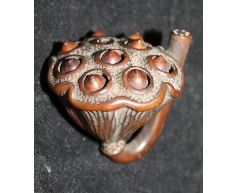A Japanese Meiji Period carved boxwood netsuke as a lotus flower seed pod with moving seeds, approx 4.1 cm long CONDITION REP
