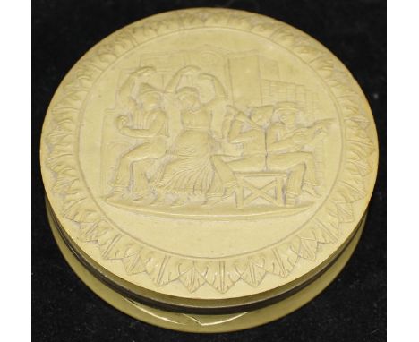 A mid 19th Century Grand Tour memento carved lava box decorated with figures in an interior dancing and playing musical instr