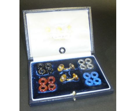 A Garrard 18ct gold cufflink set, the central links with interchangeable rings in carnelian, onyx, tiger's eye, blue agate, a