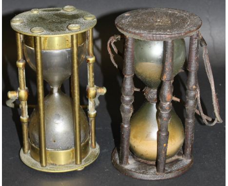 A 19th Century brass sand timer with adjustable handle and hanging loop, inscribed "Crichton London" 4 over love heart with l