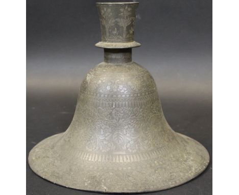 An 18th Century Mughal pewter inlaid candlestick of bell form with all-over scrolling foliate and floral decoration, 20 cm hi