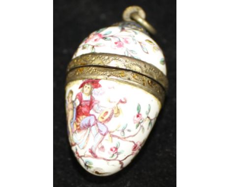 A 19th Century Continental silver gilt and enamel decorated vinaigrette in the form of an egg, the body decorated with floral