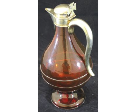 A ruby glass and silver mounted wine flagon with Maltese Cross thumb piece (by George Fox, London, 1871), 24.5 cm high CONDIT