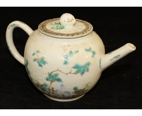 A Chinese Qianlong Period teapot, polychrome decorated with flowers in a fenced garden, together with an associated lid with 