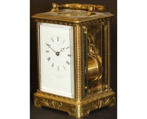 A late 19th Century French engraved gilt brass cased carriage clock with push button repeat, the enamelled dial with Roman nu