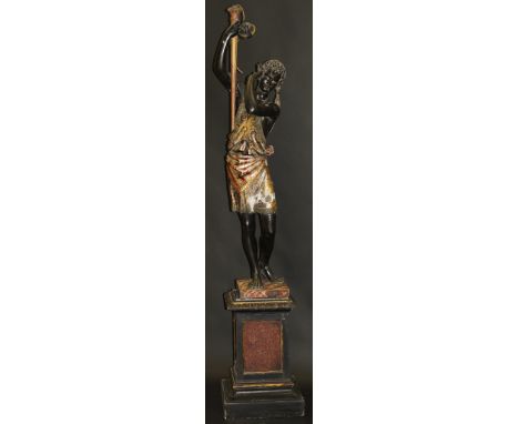 A carved wood and gesso and painted standard lamp in the form of a blackamoor in Arabesque robes, with floral decoration, sta