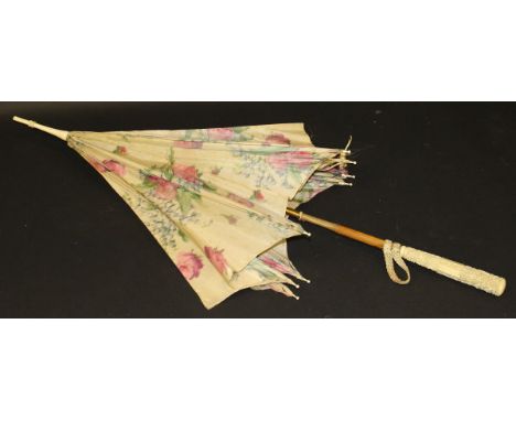 An early 20th Century parasol with carved ivory three section handle, the top section decorated with figures in a landscape, 
