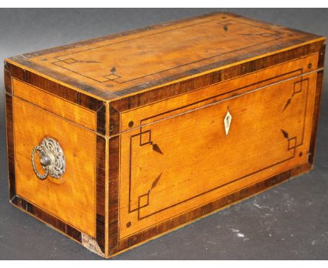 An early 19th Century satinwood, rosewood cross-banded and inlaid tea caddy, the top rising to reveal a central mixing bowl f