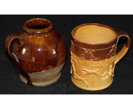 A late 18th Century lead glazed honey pot of bellied form with loop handle, 16 cm high, together with a 19th Century Doulton 