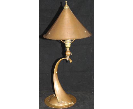 A Birmingham Guild of Handicrafts copper wall light or table lamp designed by Arthur Stansfield Dixon, the tapering scrollwor