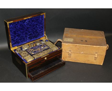 A 19th Century coromandel and brass bound vanity case by Jenner and Knewstub, the lid opening to reveal a fitted interior com