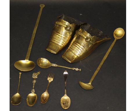 A pair of 19th Century Spanish or Peruvian brass stirrups of shoe form, 25.5 cm long, together with a collection of brass war