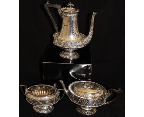 A Victorian silver three piece tea set comprising a water jug, teapot and twin-handled sucrier, decorated in the Classical ma