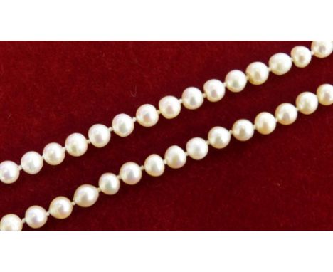 A single row cultured pearl necklace of uniform form comprising 75 x 7mm beads to a 9 carat gold and pearl cluster clasp