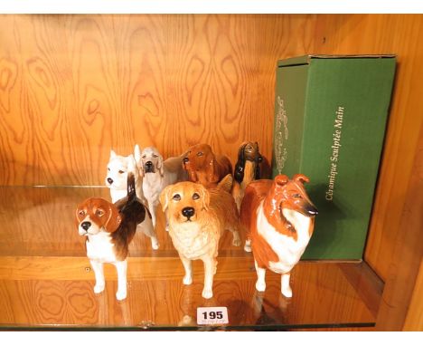 A collection of seven Beswick dog figurines to include a beagle