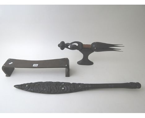 Fijian wooden cannibal fork on stand, 20th century, with carved and inlaid mother of pearl decoration; a Fijian wooden stand 