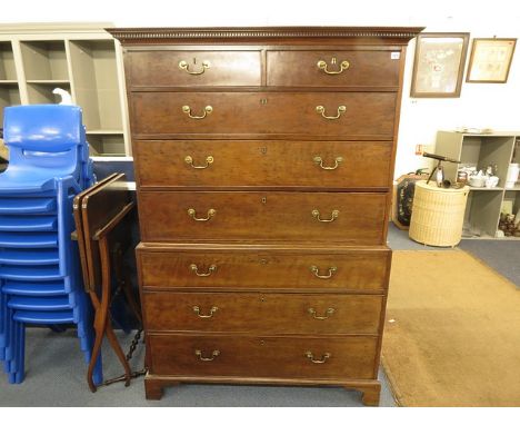A Georgian mahogany chest on chest having two short drawers above six long drawers, a dental moulded cornice and four bracket