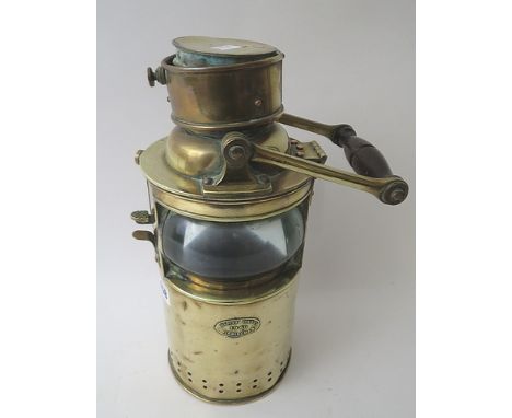 Bulpitt & Son Ltd, Birmingham a brass Morse code ship's light, circa 1940, dated makers label to front, brass and turned wood