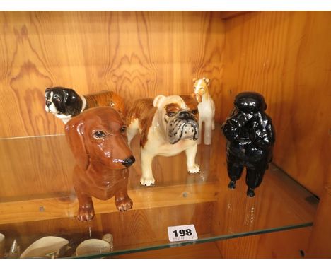 A collection of five Beswick dog figurines to include a Poodle, Dachshund, Great Dane and others