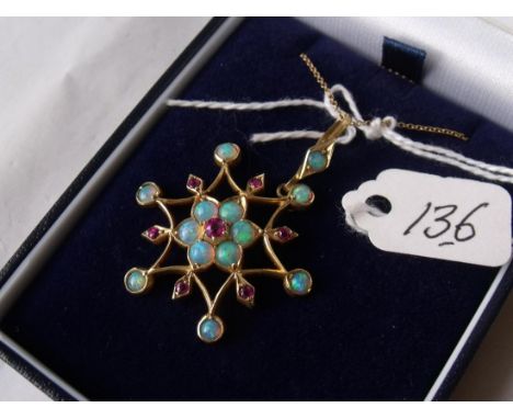 A GOOD ANTIQUE 18CT GOLD RUBY AND OPAL star pendant on fine link gold chain