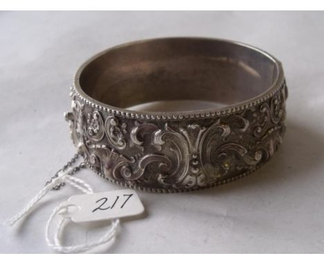 Wide heavily embossed Eastern silver bangle 46g   
