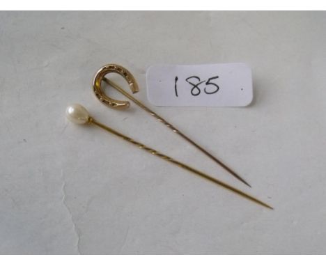 Two gold mounted stick pins      