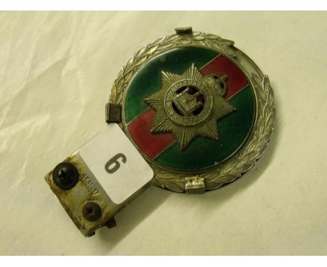 Vintage enamel decorated car badge ‘The Devonshire Regiment’ badge to centre      