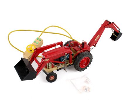 A Japanese tinplate Ford 4000 tractor. Red body with a black plastic steering wheel and shovel, attached to a single battery 