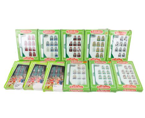 Eleven vintage Subbuteo figure packs. Teams include 410 Brazil, 666 Queens Park Rangers, England, 393 Northern Ireland, 619 L