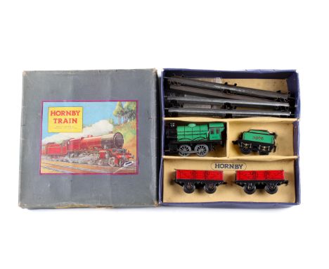A Hornby 0 gauge clockwork M O Goods Set. Comprising 0-4-0 locomotive and tender, BR lined livery No.2595, with two wagons an