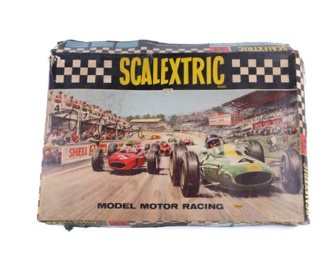 A boxed Scalextric set 31 and power unit. The set including two cars, track, accessories and a manual