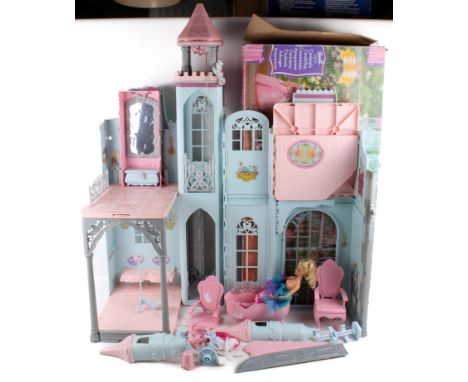 A vintage Barbie Cinderella Castle, several castle accessories and a figure. 