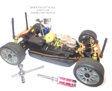 SY Racing 1:8 scale radio control racing car. Four wheel drive, glow fuel engine, with receiver, transmitter etc. fuel, glow 