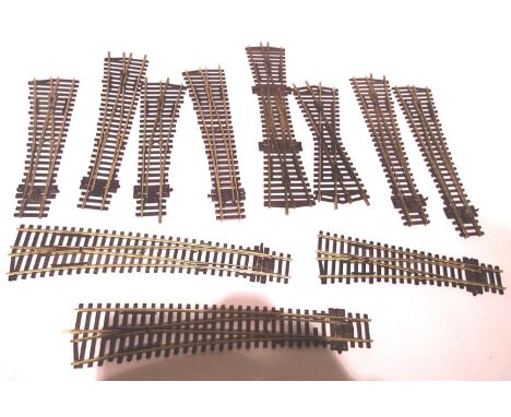 Eleven assorted Peco and Hornby points including double slip, mostly good/used. P&amp;P Group 1 (£14+VAT for the first lot an