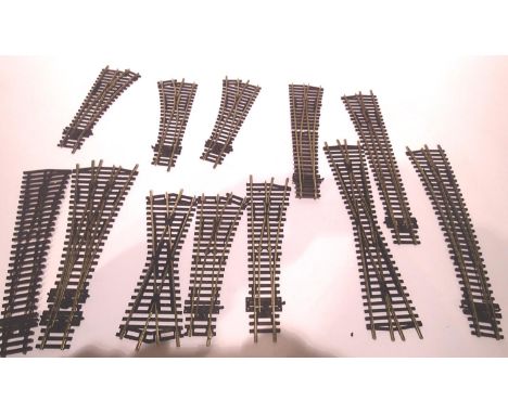 Twelve assorted Peco and Hornby points including 3 way mostly good/used. P&amp;P Group 1 (£14+VAT for the first lot and £1+VA