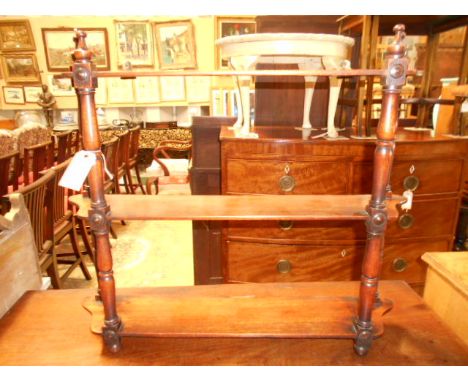 A Victorian mahogany three tiered hanging shelf