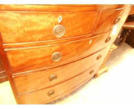 An early 19th C mahogany line inlaid bow front chest of two short and three long cock-beaded drawers with ivory escutcheon an