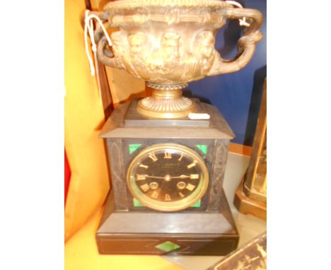 A Howells and James slate mantle clock having black dial with gilt Roman numerals, eight day movement and applied bronze Bacc