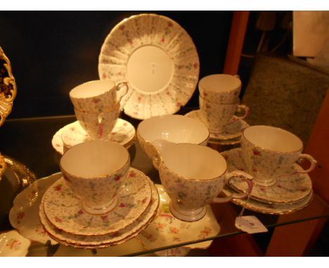 A Royal Grafton part tea set in 'Chantilly' pattern comprising cake plate, cups, saucers, sugar bowl etc (A/F)