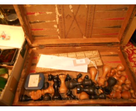 A mid-19th C Jacques of Dublin boxwood chess set housed in a compendium, in the form of a  pair of books, containing carved c