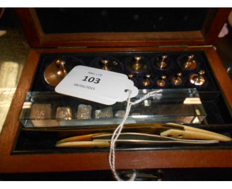 A cased set of late 19th C Griffin & Tatlock brass apothecary weights and ivory handled tweezers 