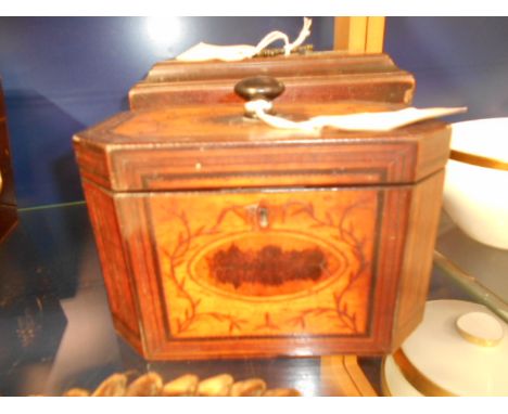 A Georgian walnut inlaid and chequered strung two compartment tea caddy with canted corner decorated with trailing vines and 