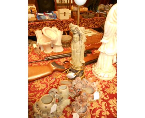 A mid-20th C table lamp in the form of a Chinese female with branch and blossoms, along with three Chinese soapstone figural 