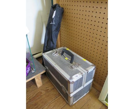 A metal camera case containing Cokin filters, other filters and adaptors, a flash gun and various other camera accessories, a