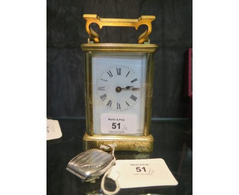 A brass carriage timepiece, of conventional form with enamel dial, the single train movement stamped R and Co Paris, 14.5 cm 
