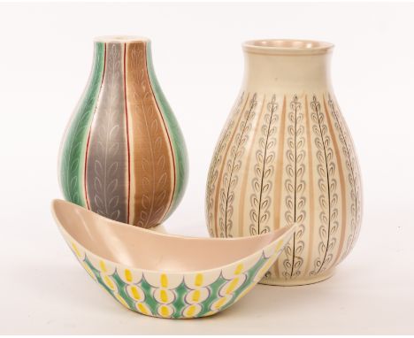 Poole Pottery, a baluster vase, shape 337, decorated stylised leaves and stripe, 24cm high, a lamp base, 24cm high and a boat