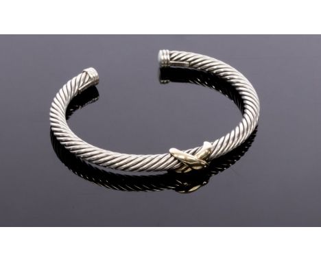 David Yurman, a silver and gold cable bangle, with central 14ct yellow gold cross, signed, approximately 28gm CONDITION REPOR