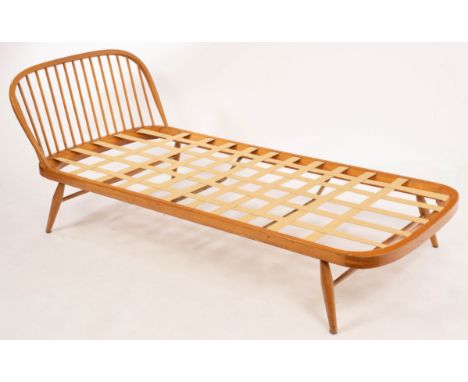 Lucien Ercolini for Ercol, an elm and beech single bed, with curved spindled headboard, 194cm wide